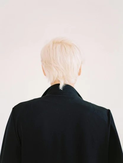 an image of back view of a person wearing a black shirt