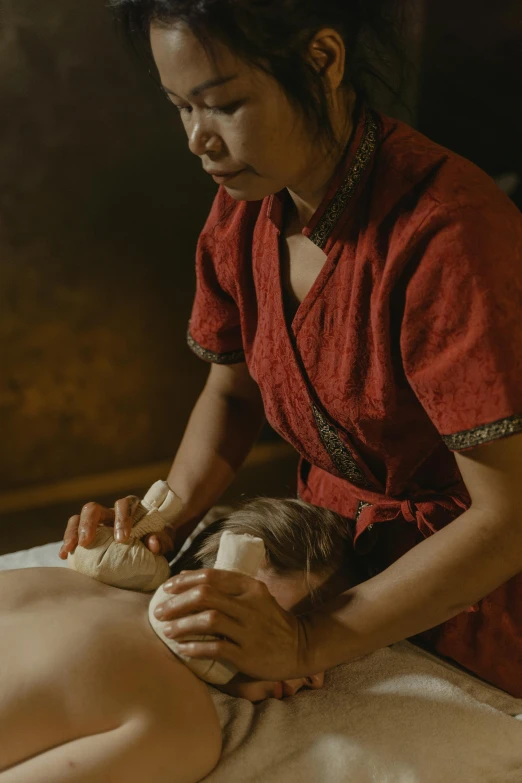 a woman is receiving a deep tissue massage