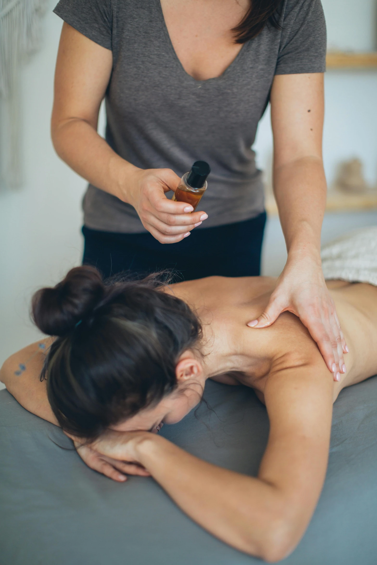 a woman being massaged by a beauty professional