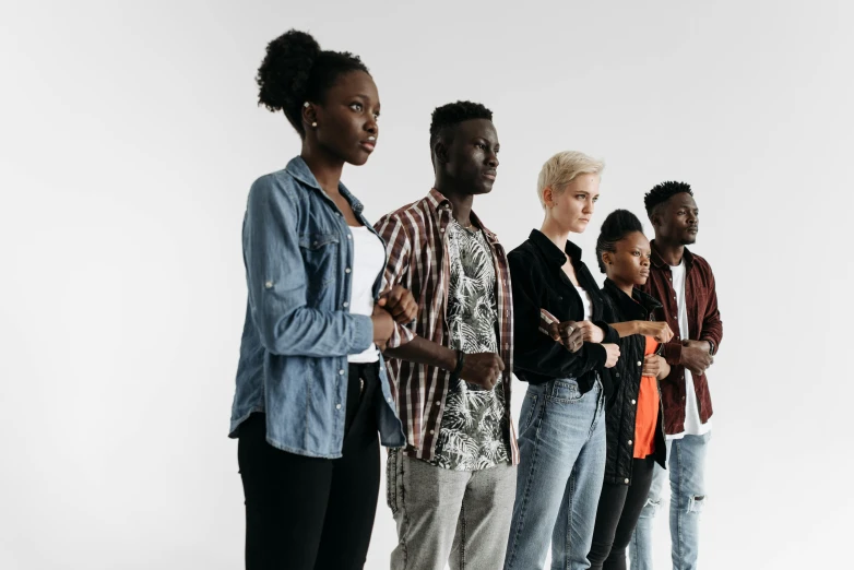 a group of young women and men standing in a line