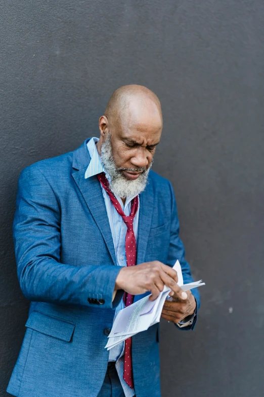 an african american business man reading paperwork