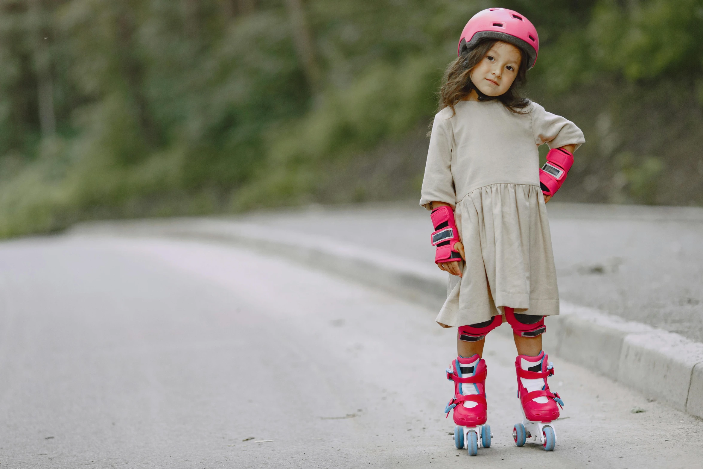 the  is riding her skateboard on the street