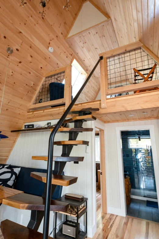 staircase in modern home with wood paneled wall