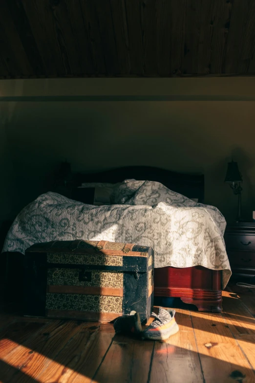 a bedroom with a bed and suitcases on the floor