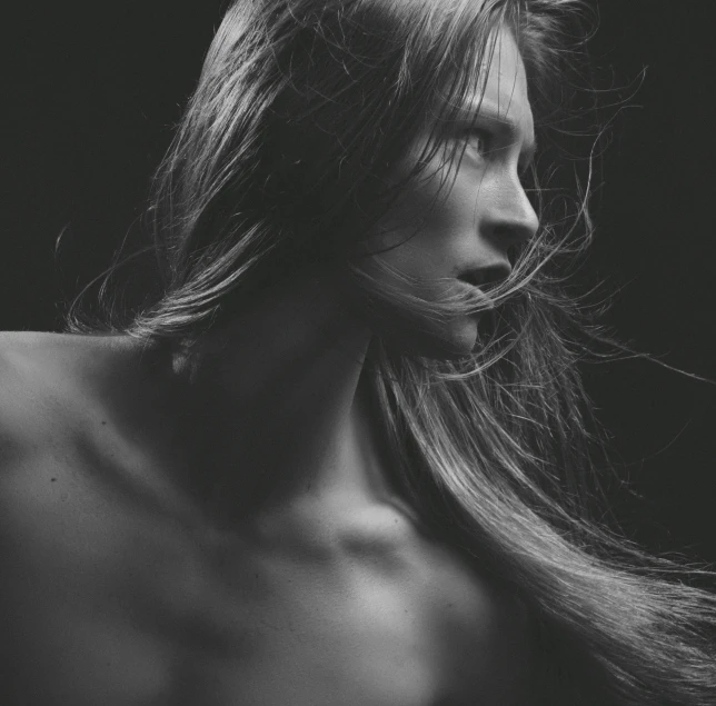 a black and white po of a girl with long hair