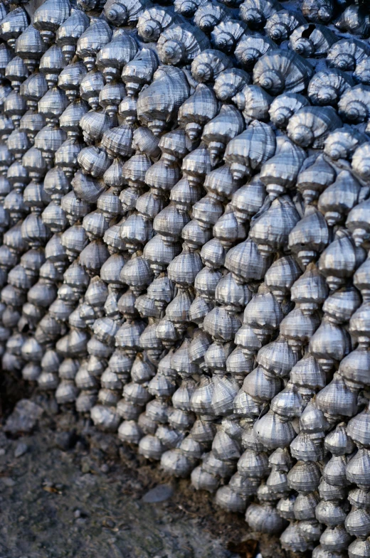 a bunch of metal objects sitting on top of a sidewalk