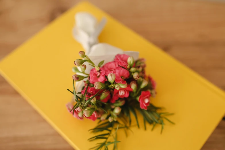 the bouquet is laying on the table ready to be bouqueted