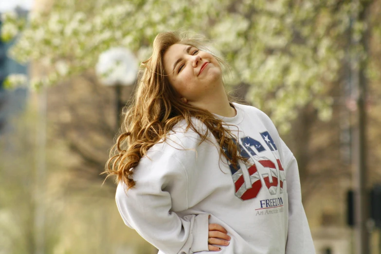 a  in a white hoodie is looking upward