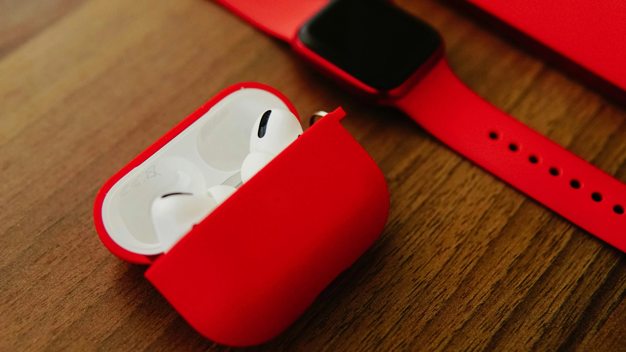 a red apple watch with the cover removed