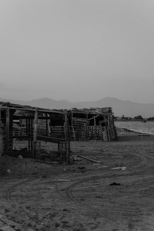 some huts by the water in the middle of nowhere