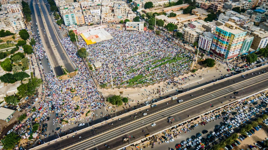 aerial view of a group gathered in an area next to a highway