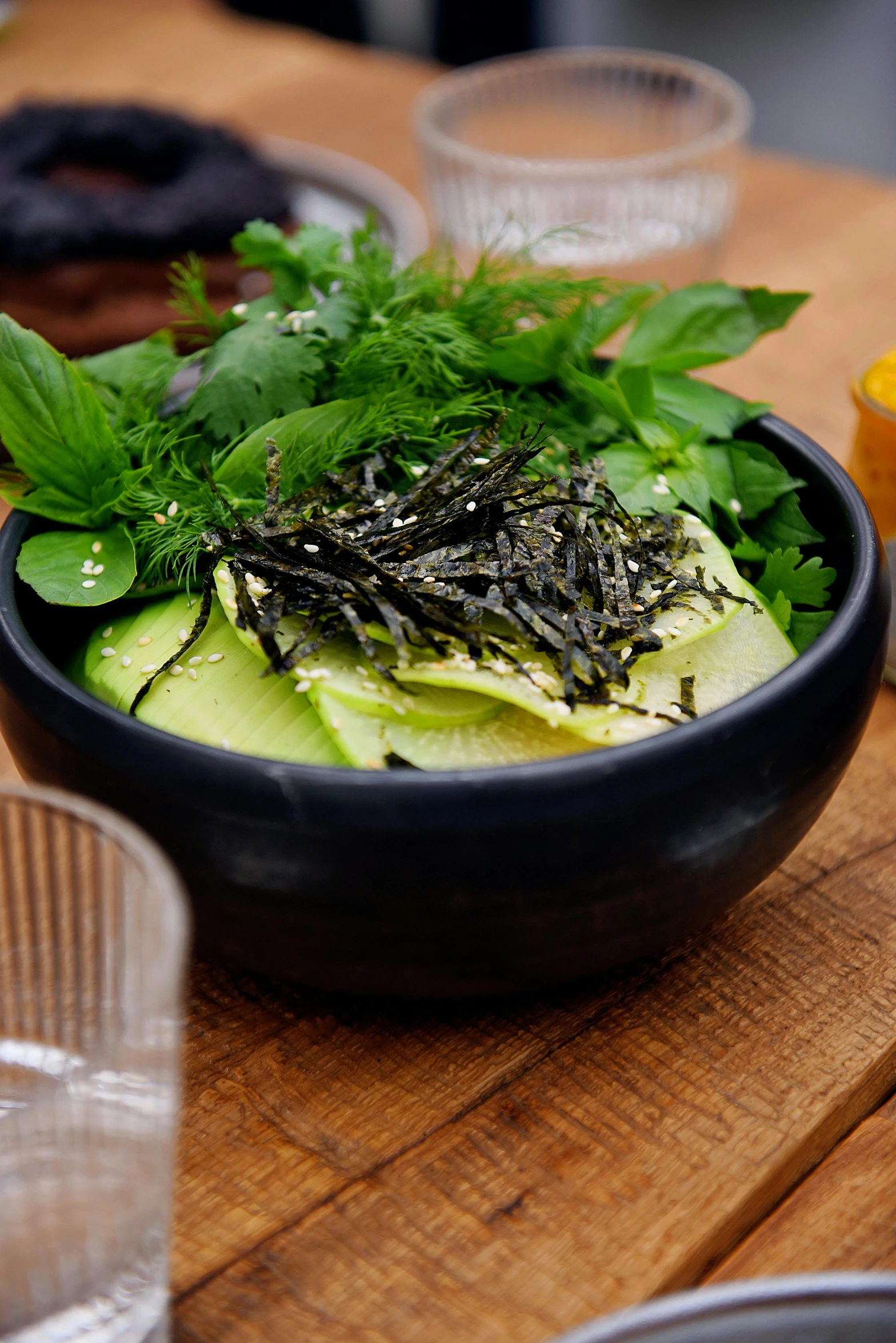 a bowl is set on a table with various things