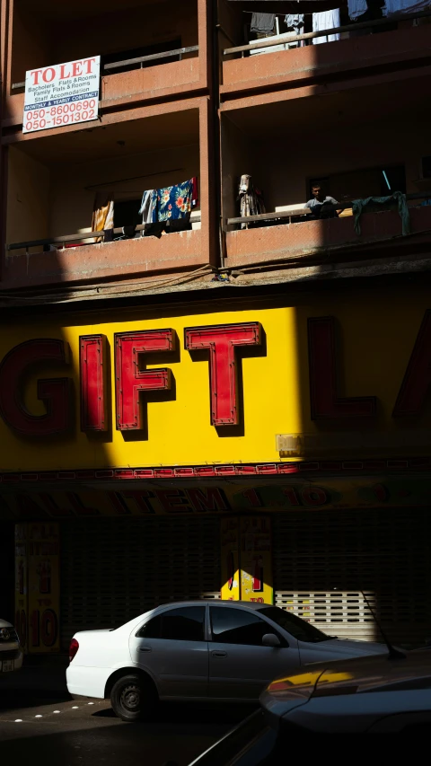 an old building that has been decorated with signs