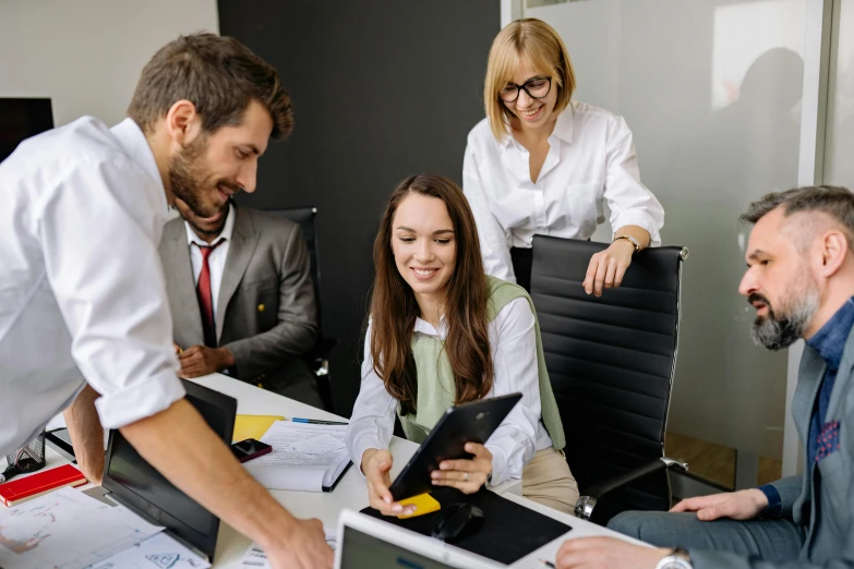 people in an office working on computers