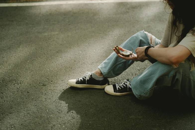 the young person is tying up her shoes