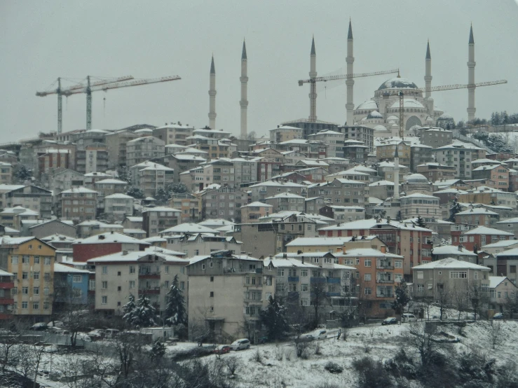 there are several buildings that have towers with domes on top