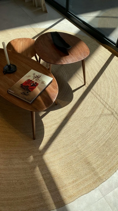 a table with books on it near a glass wall