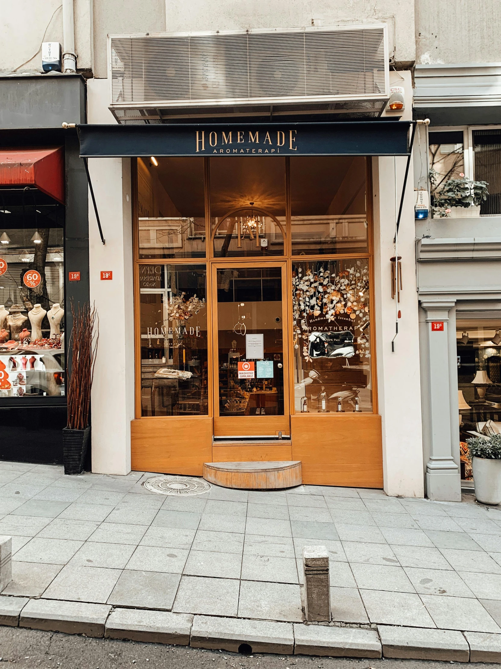 a store with two levels that has shelves and displays of food inside