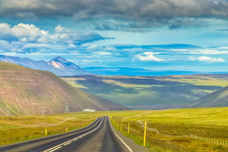 a very long highway going in the direction of mountains