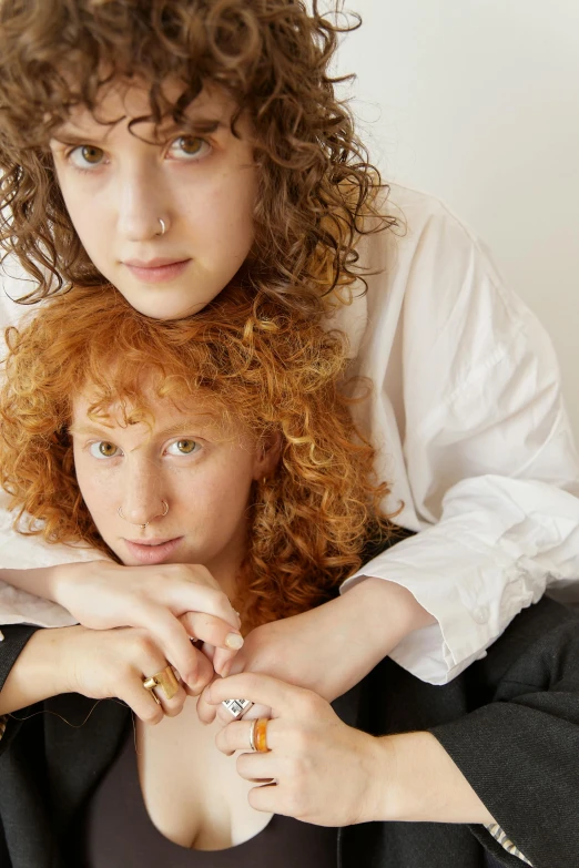 an image of two women that are looking at the camera