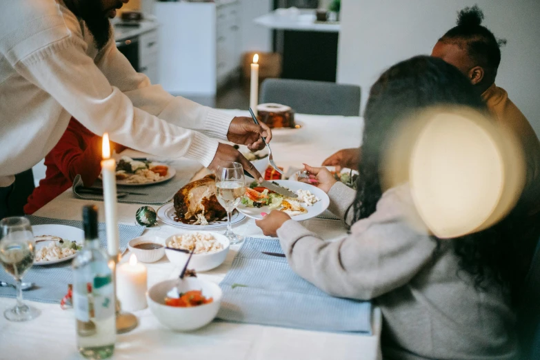 a family sharing a holiday meal at a dinner table