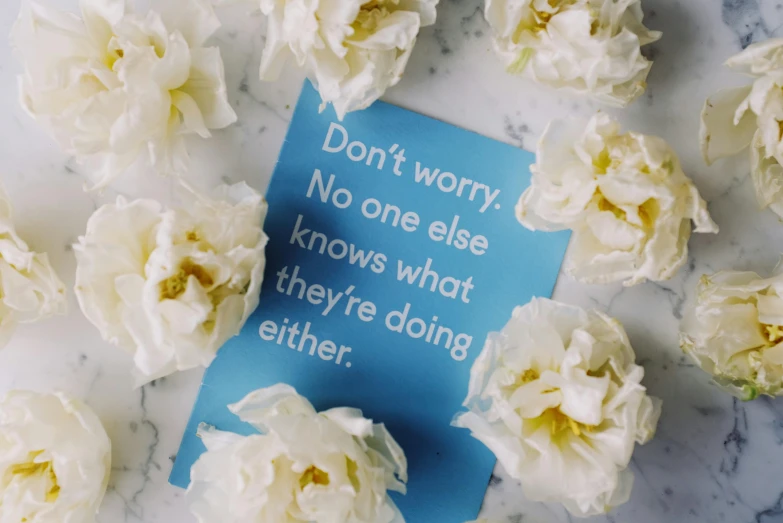 a piece of paper that has been placed on a table with flowers