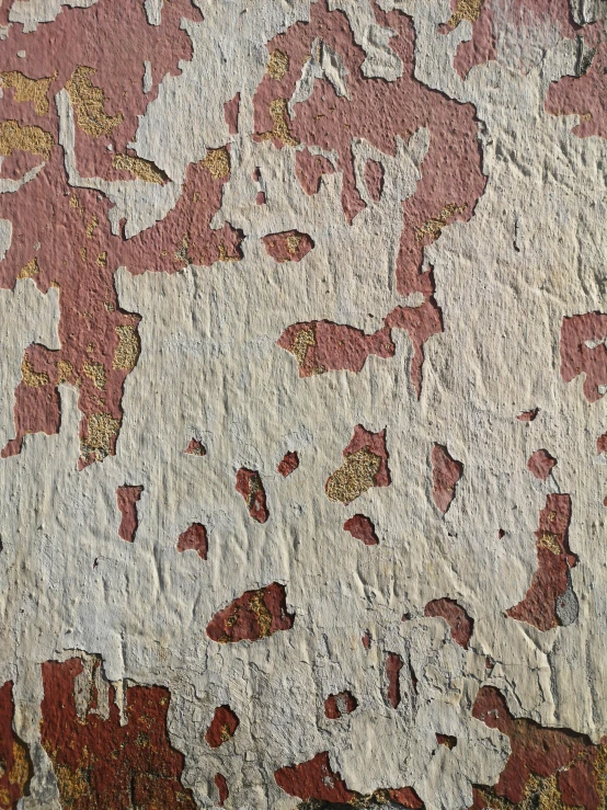 a wall with orange, white and yellow paint