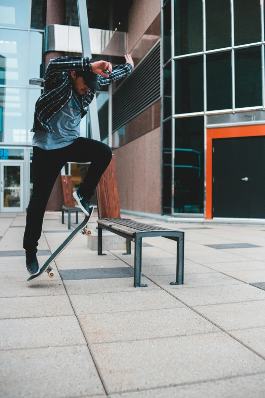 a skateboarder with his arms extended and his head down