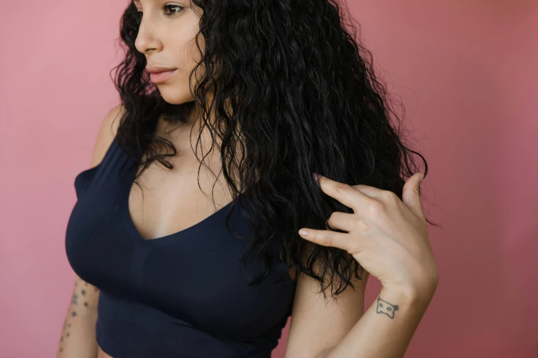 a close up s of a woman with large curly hair