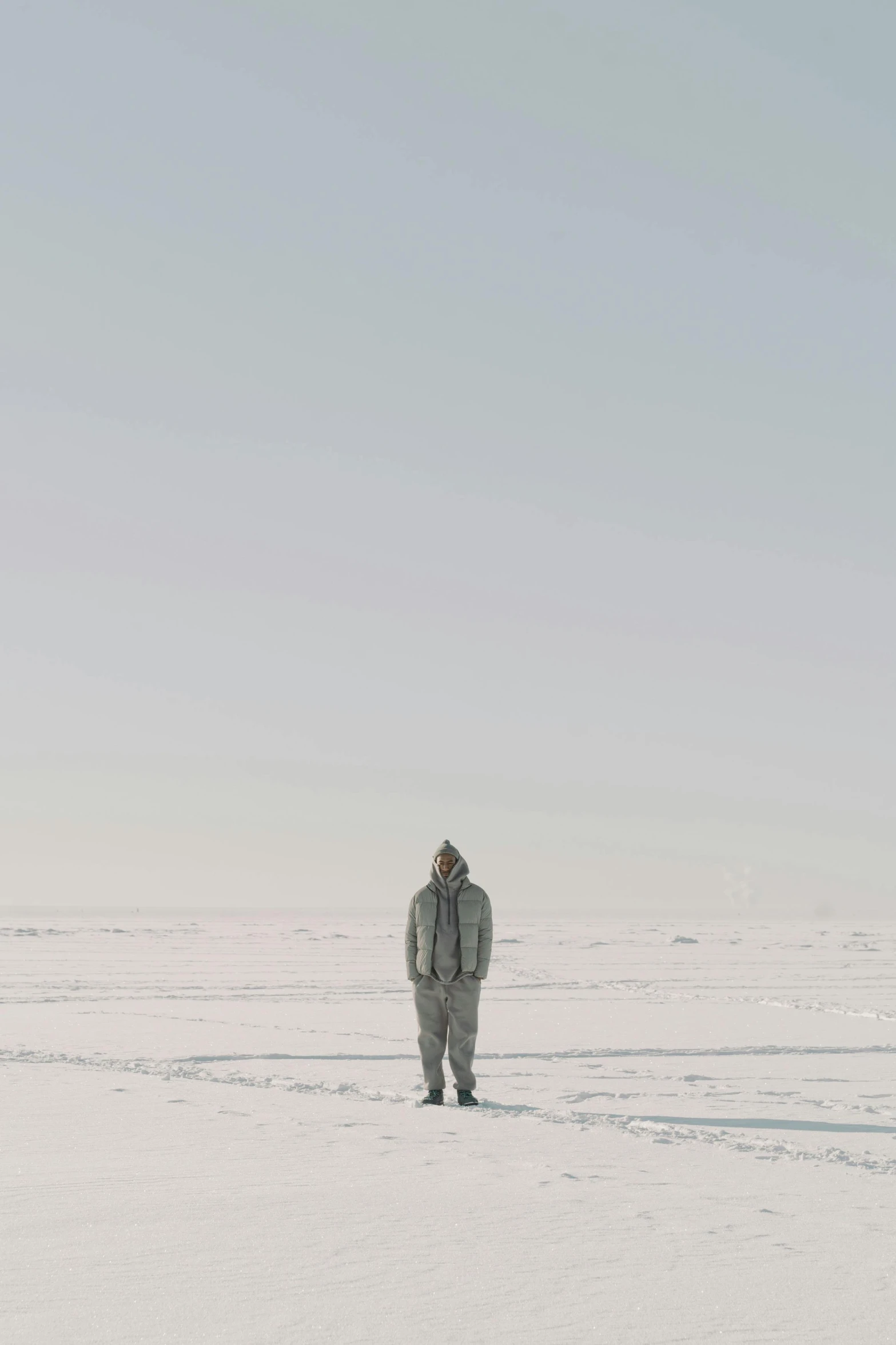 a man standing in the middle of a field