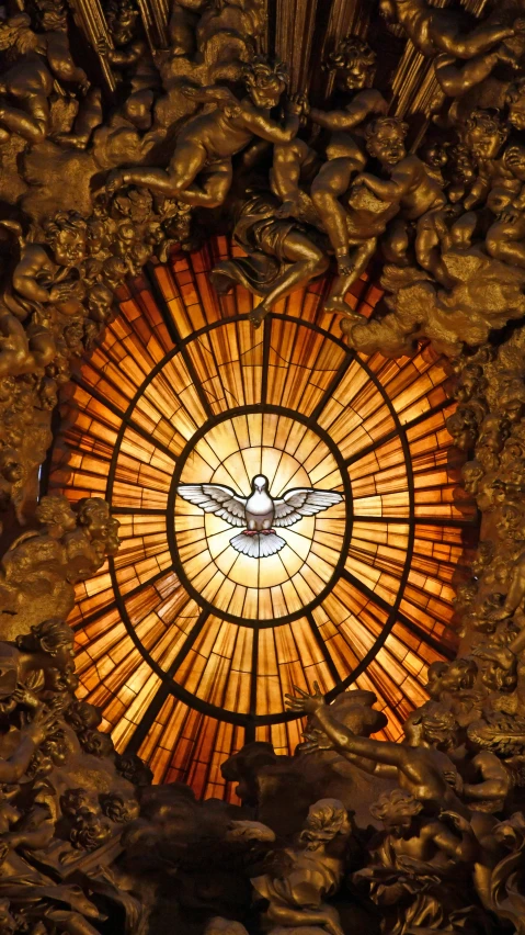 a stained glass round window that features angels