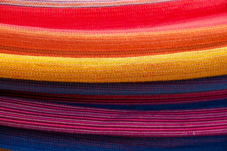 a striped blanket in multiple different colors