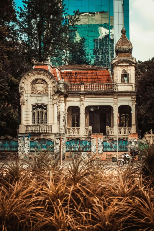 an old dilapidated house with a red roof