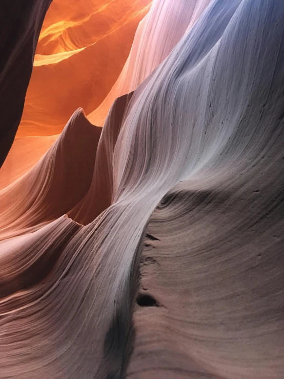 an orange canyon features several layers of thin rock