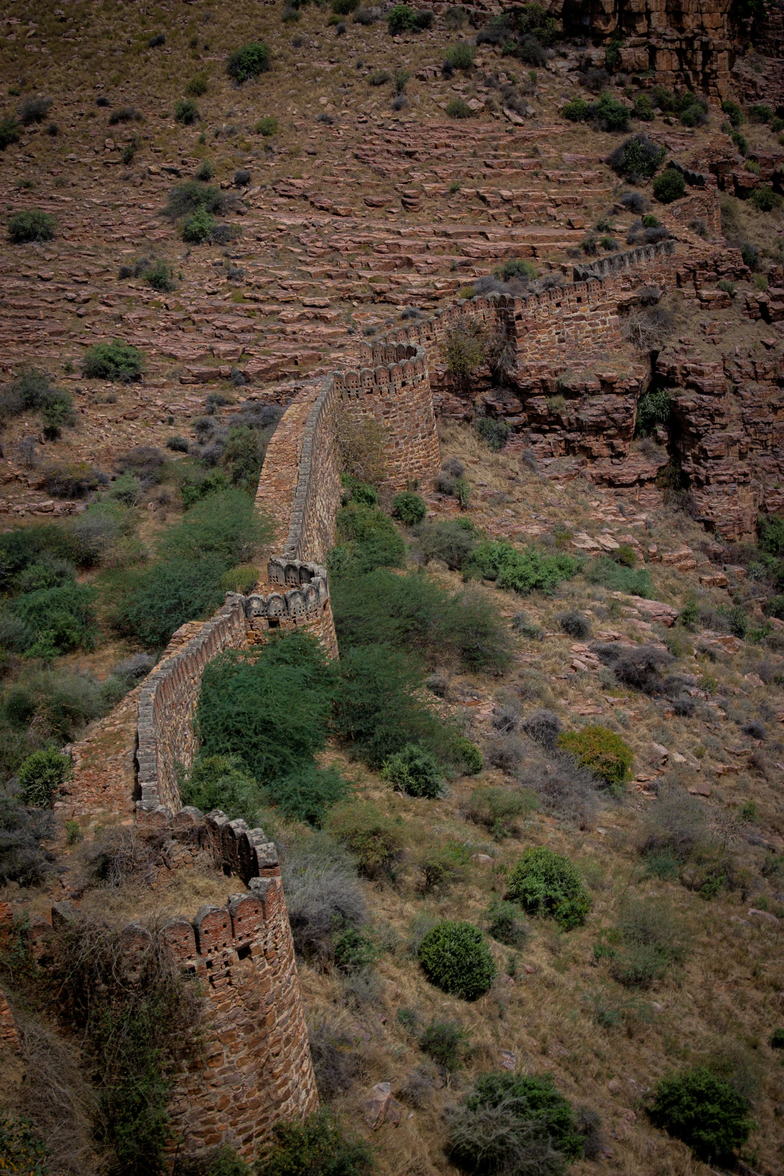 a view from a high angle looking at a stone wall