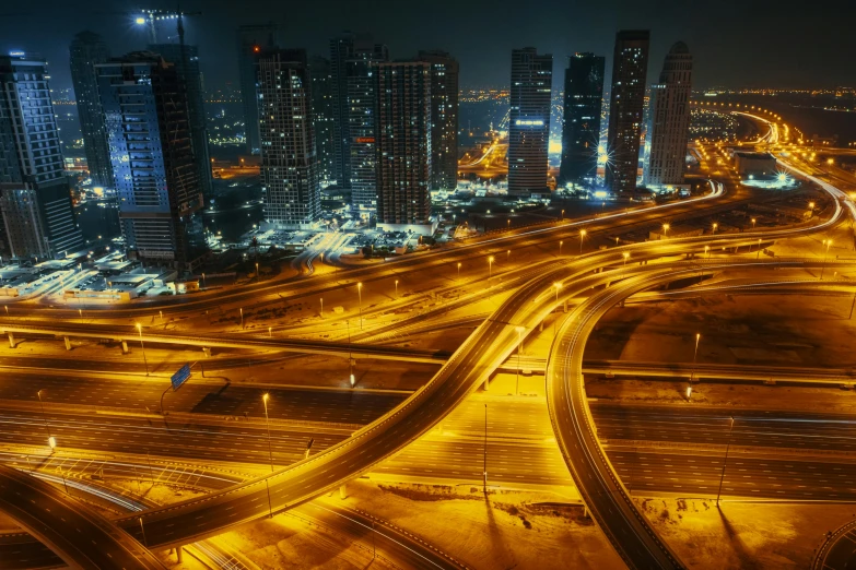 an aerial view of a freeway in the city at night