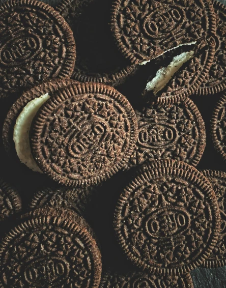 oreos filled with white cheese on a tray