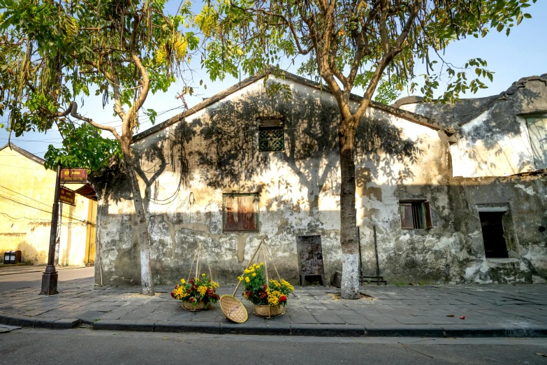 two vases sit outside of an old building