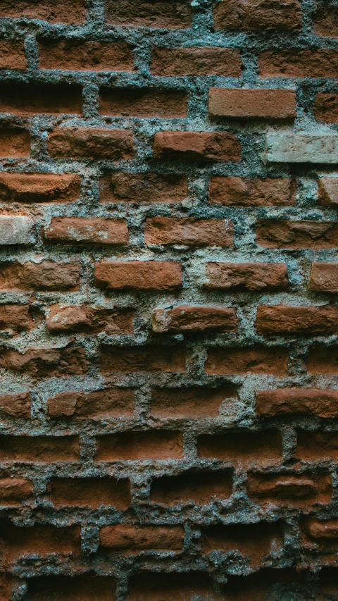 a large old brick wall made from red bricks