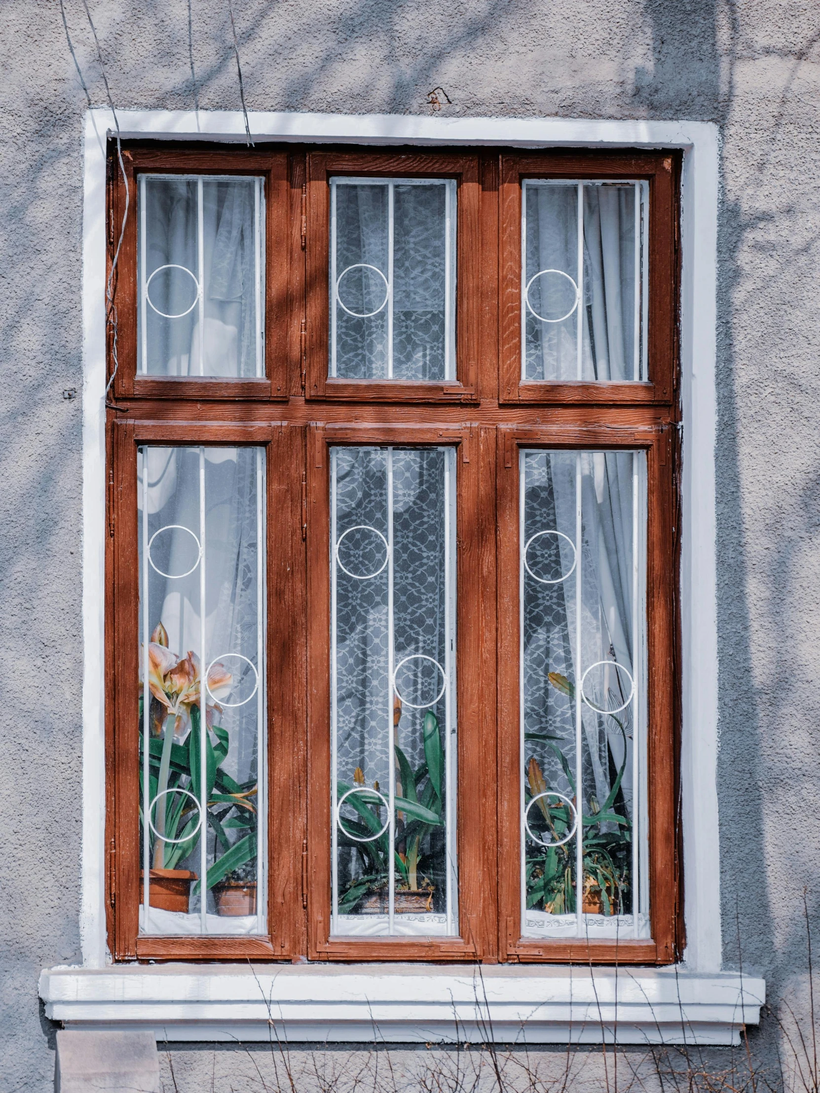 an old fashioned window with a wooden frame