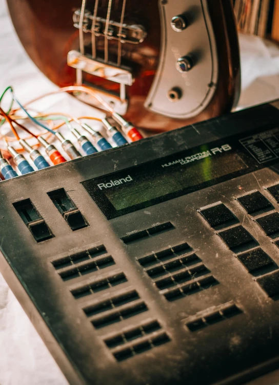 a guitar and sound board on the table