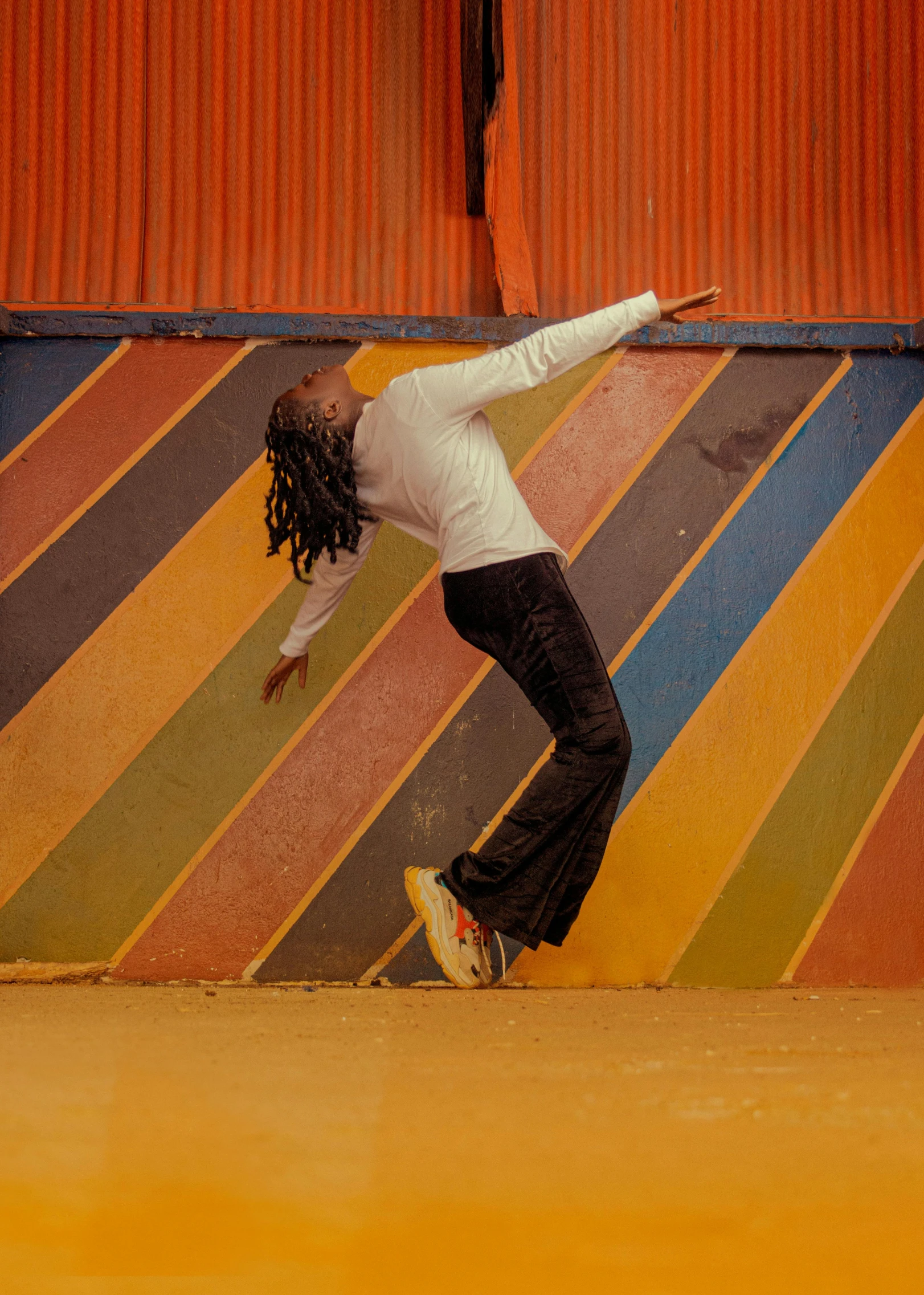 a woman that is standing on top of a skateboard