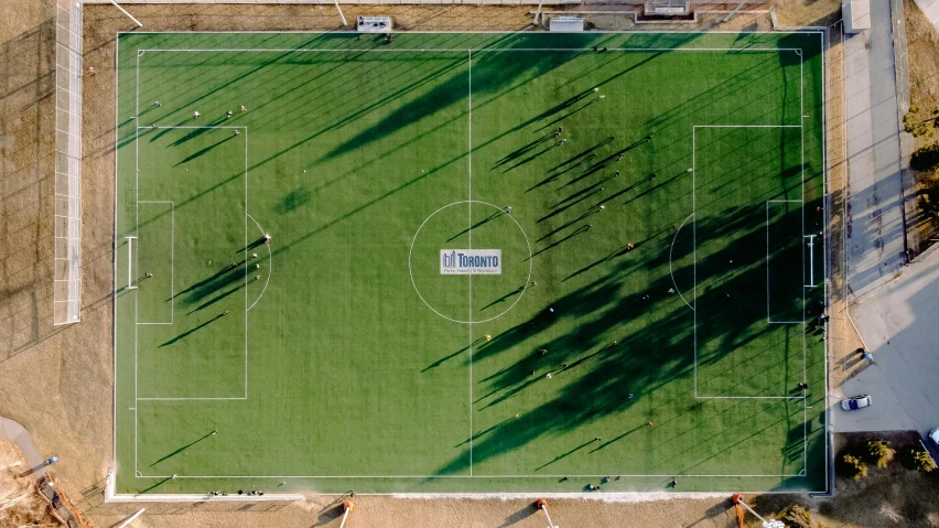 an overhead view of a soccer field in a park