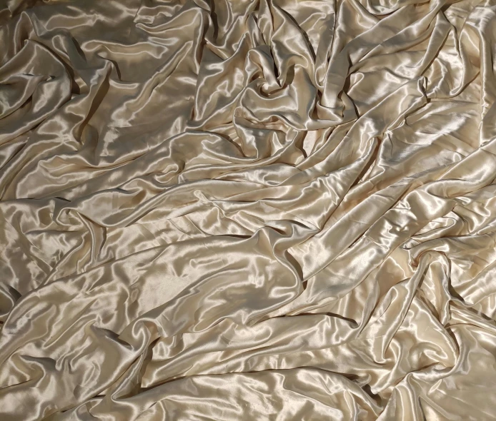 an abstract po of a light colored surface with lots of folds