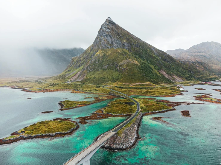 aerial view of a mountain with blue water