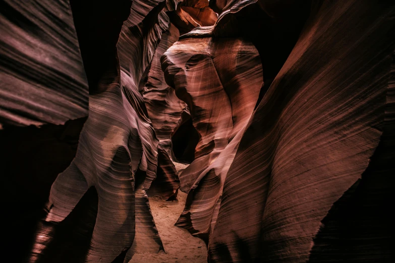 a narrow, canyon like area of light reflecting off the ground