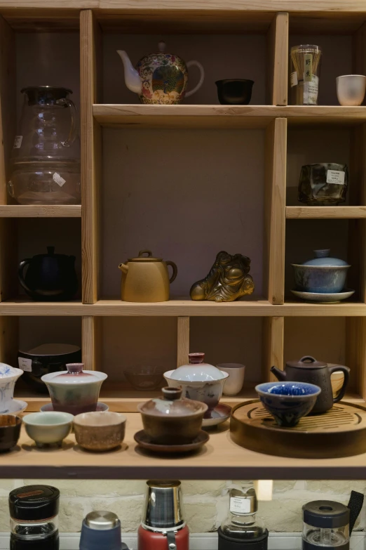 shelves holding some different kinds of bowls and dishes