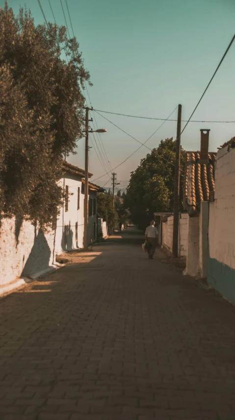 the shadow of a street sign is seen on a road