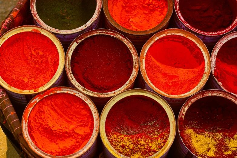 a picture of many colorful bowls of powdered food