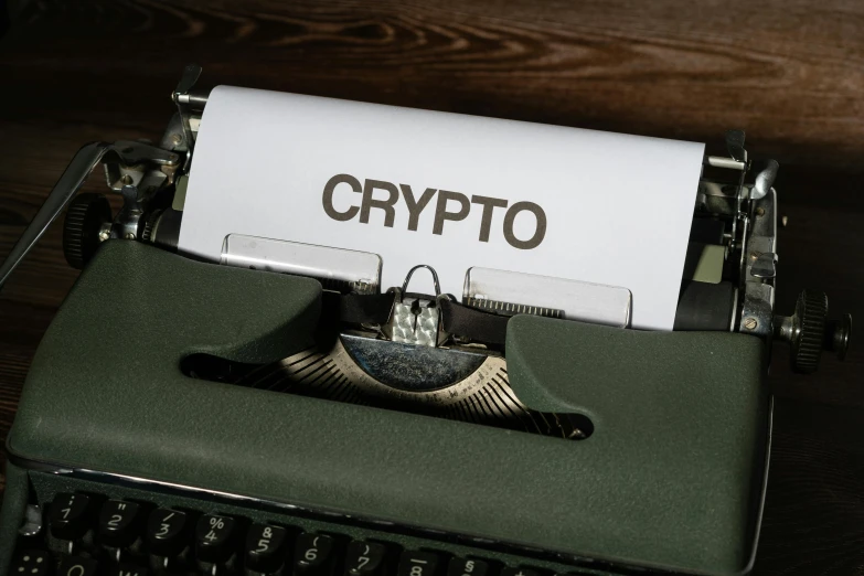 a typewriter with a sign that reads crypt on it